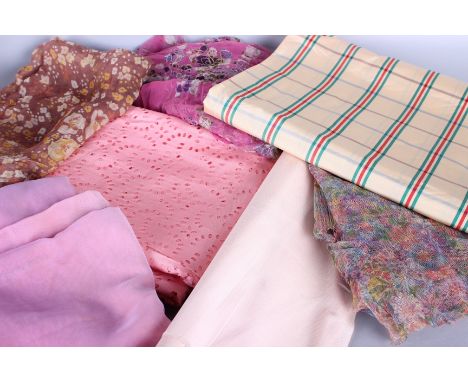 A quantity of early to mid 20th century textiles and dress making fabrics, including: checked taffeta, netting, gauze and sim