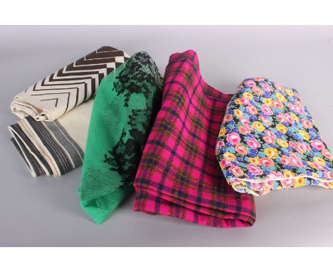 A quantity of textiles and fabrics, including: dressmaking lengths, cottons, tweeds, remnants and fabric suitable for soft fu