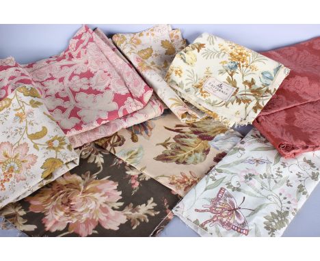 A quantity of upholstery weight and furnishing fabrics, comprising: woven textiles, damask, printed linen and floral cottons.