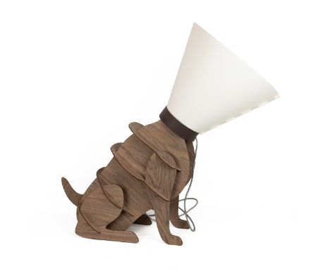 Novelty dog in collar lamp. Interlocking fibreboard construction with shade fashioned as a dog's medical collar. W 34cm, D 85