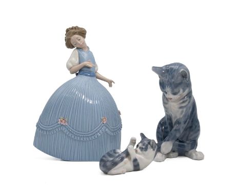 Lladro 'Girl in Blue Dress,' H 26cm; and two Royal Copenhagen cat figures, numbers: 340, seated cat (H 19cm) and 727, playful