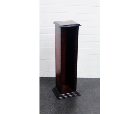 A stained wood CD tower, 72cm high