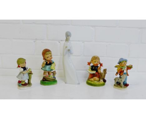 A Spanish porcelain figure together with four Hummel style figures, (5)