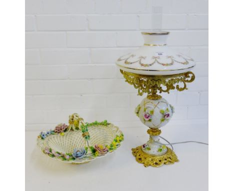 A floral encrusted porcelain lamp with opaque glass shade together with a floral encrusted basket, (2) 