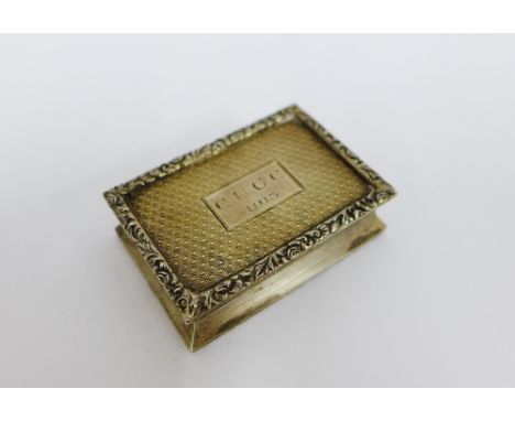 George VI silver pill box  with engine turned hinged lid, opening to reveal a silver gilt interior, Birmingham 1912, 5cm