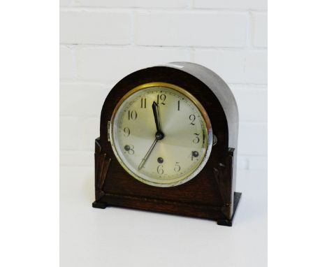 An oak cased Art Deco mantle clock