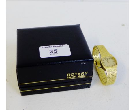 Lady's gold plated Rotary wristwatch with a champagne dial having hour baton markers, on a textured strap, complete with box 
