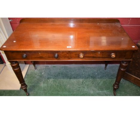 A Victorian mahogany serving/side table, rectangular top with shallow half gallery above a pair of frieze drawers, turned tap