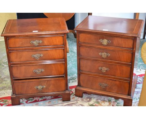 A pair of George III style lamp chests, each with a crossbanded rectangular top above four drawers, bracket feet, 68cm high (
