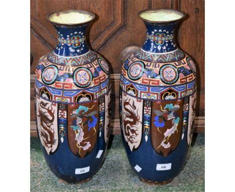 A pair of Chinese cloisonné vases, the shoulders with colourful geometric patterns, the sides with alternating panels of drag