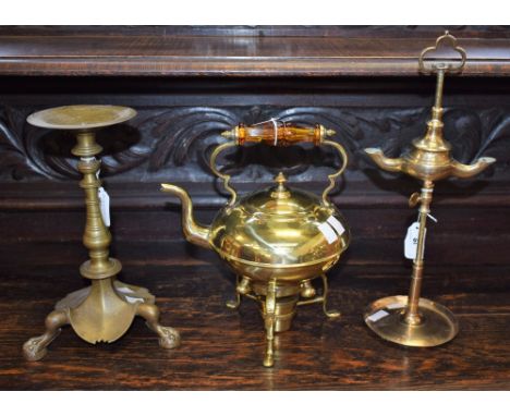 An Arts and Crafts brass tea kettle on stand, with burner, amber glass handle, marked 3, tripod stand, 26cm high overall; a b