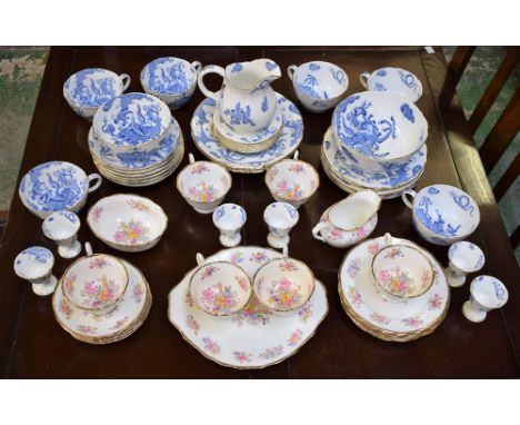 A Royal Worcester Blue Dragon pattern part tea service, comprising cups, saucers, side plates, cake plates, egg cups, milk ju