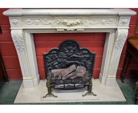 An Elgin and Hall Regency style chimney piece, stepped mantel shelf, the centre tablet moulded with a ribbon-tied swag of sum