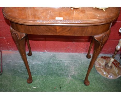 A Queen Anne style walnut and mahogany card table, 79cm wide