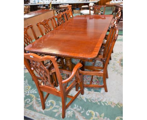 A contemporary extending dining table, extending to 244cm; a similar sideboard; a set of ten Chippendale style dining chairs 