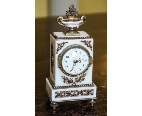 A 19th century white marble mantel clock with gilt metal mounts, the enamel dial signed Hunt &amp; Roskell, 16cm high