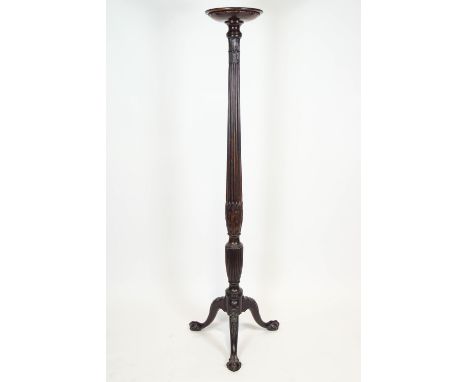 A mahogany torchere, ex a late 18th century tester bed, of ribbed baluster form with bands of laurel leaf decoration, raised 
