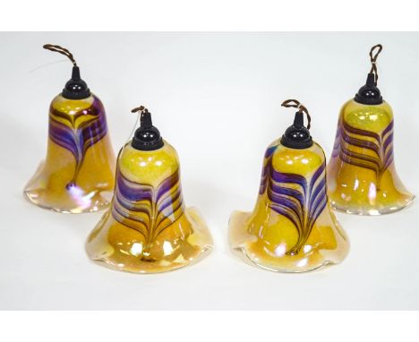 Four Favrille style light shades, of tulip form in iridescent yellow with trailed purple overlay, 23cm high (max)