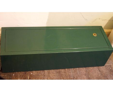 A modern green metal gun cabinet with keys, 87cm high x 29cm wide x 23cm deep