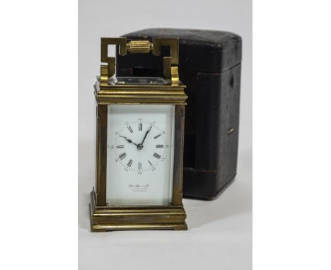 A gilt brass five glass carriage clock by John Hall &amp; Co of Manchester, with a white enamel Roman dial, striking on a gon
