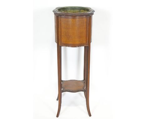 An Edwardian mahogany shaped square plant stand, the bowed sides set an inlaid panel in stringing frame, over a similarly sha