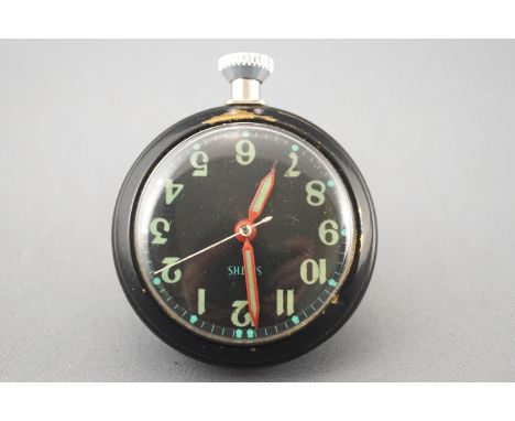 A black cased open face magnetic dashboard pocket watch by Smiths. Manual wind movement; black dial with illuminous markings;