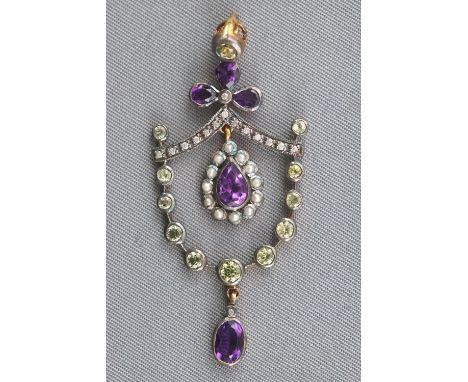 A yellow and white metal abstract pendant set with amethyst, peridot, diamonds and seed pearls. No hallmark - acid tests indi