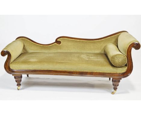 A mahogany double scroll end asymmetric late Regency sofa with back rail and worked front raised on turned baluster legs set 