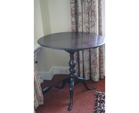 A mahogany George III style tripod table with bird cage on carved cabriole legs, 68.5cm high x 71cm diameter