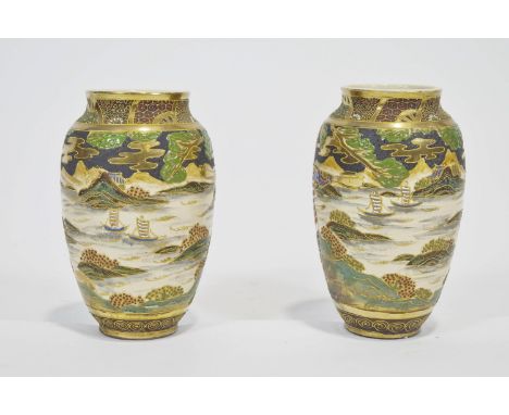 A pair of satsuma style plain baluster vases, decorated with Samurai before a seascape, highlighted with gilding, height 22cm