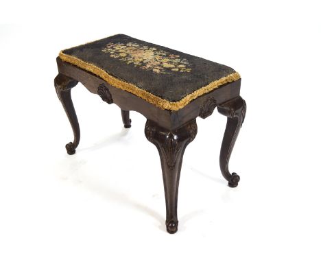 An 18th century style mahogany stool with inset tapestry seat, the frieze carved with shells on cabriole legs, 47cm high x 61