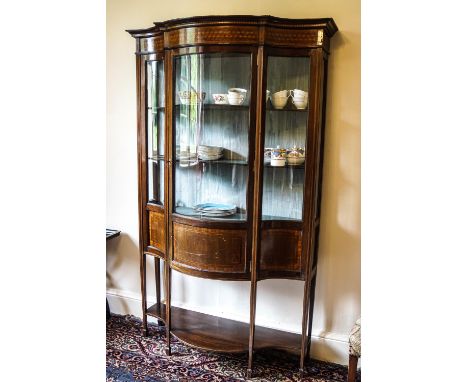 An Edwardian mahogany display cabinet with bow fronted glass, 183cm high x 112cm wide