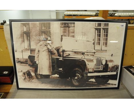 Large framed print of a black and white photograph showing Sir Winston Churchill smoking a cigar next to his Land Rover (regi