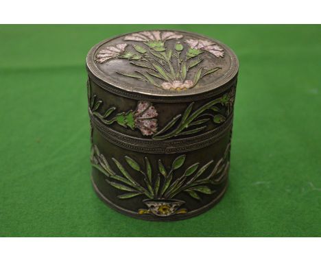 A French white metal and enamel decorated circular pot and cover.