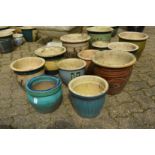 A quantity of glazed plant pots.