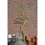 A large metal ornament modelled as a fairy.