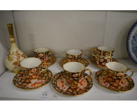 A small Worcester blush ivory bottle vase and various Crown Derby cups and saucers.