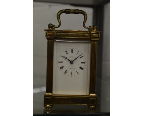 An Asprey brass carriage clock.