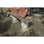 A reconstituted stone garden bench with squirrel supports (repaired).