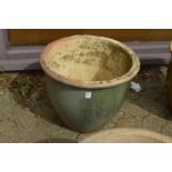 A large glazed planter.
