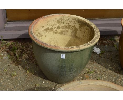 A large glazed planter.