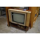 An early Philips television receiver, model number 23TG107U, complete with original manual and cable