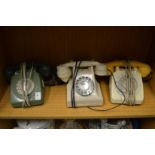 Three old telephones.