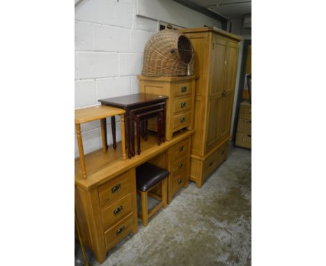 Modern light oak wardrobe together with a matching dressing table, stool and three drawer chest.