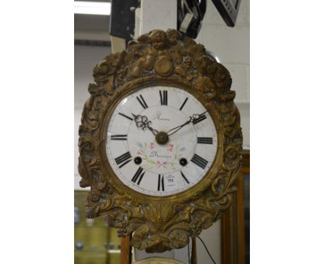 A Continental wall clock with painted enamel dial and embossed brass frame.