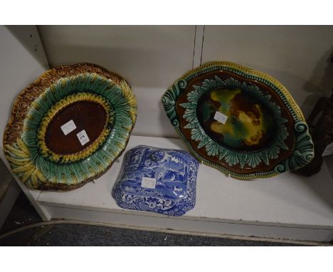 Two Majolica stands and a Spode Italian pattern vegetable dish cover.