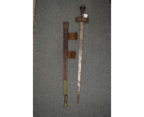 A good African sword with embossed leather scabbard.