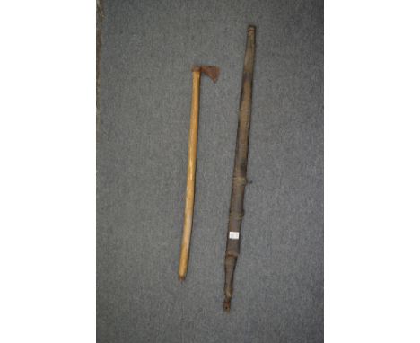 An Eastern sword and scabbard (blade corroded and unable to remove from scabbard) together with a small axe.