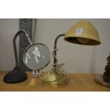 An adjustable desk lamp and similar magnifier.