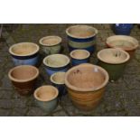 A quantity of glazed plant pots.